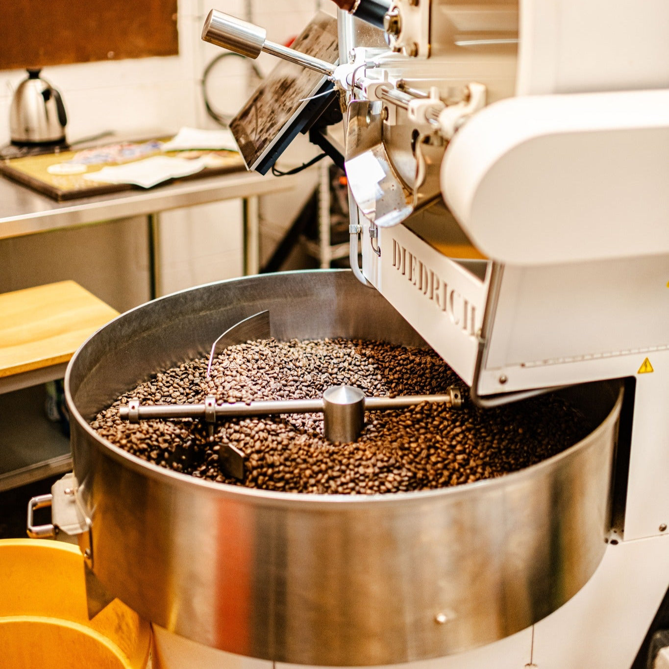 coffee roaster roasting a batch of coffee